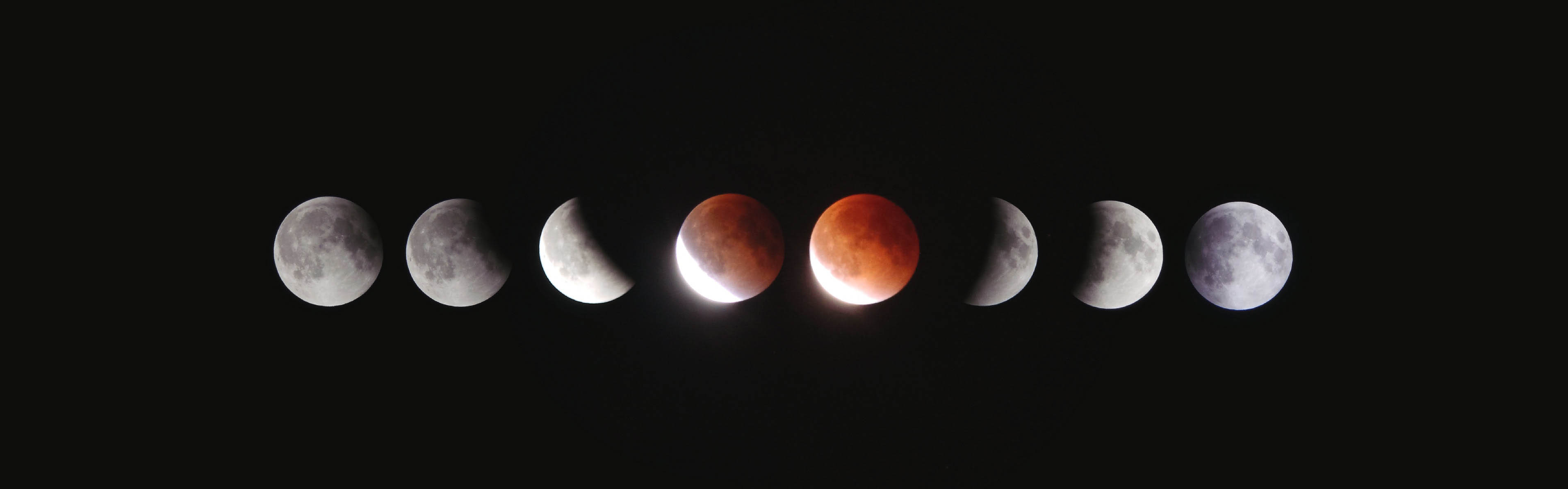 Multiple moons in a red explise side by side.