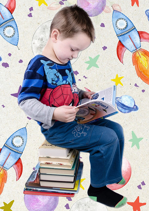 Children reading book sitting on a pile of books.